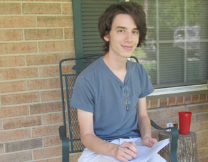 Smith works while sitting on his front porch